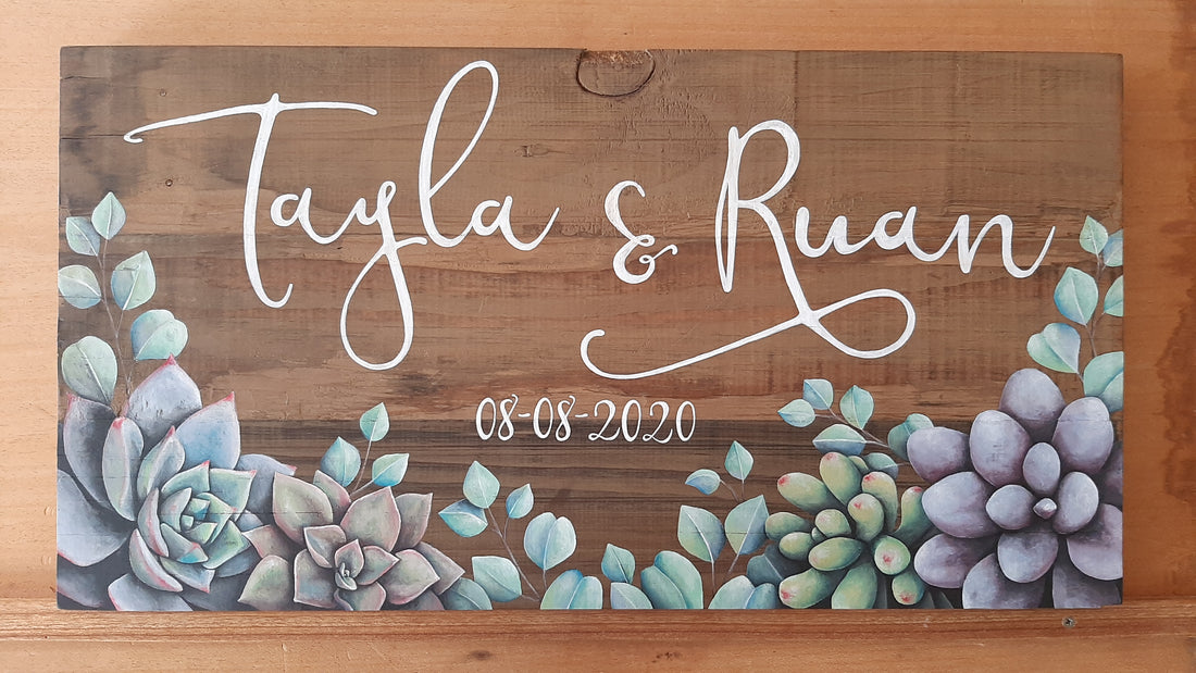 Can't lock down love: Hand-painted succulent wedding name board